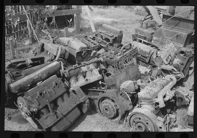 Discarded automobile motors at junkyard, Abbeville, Louisiana, 1938