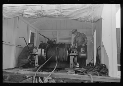 Painting elevating winches near Burrwood, Louisiana, 1938