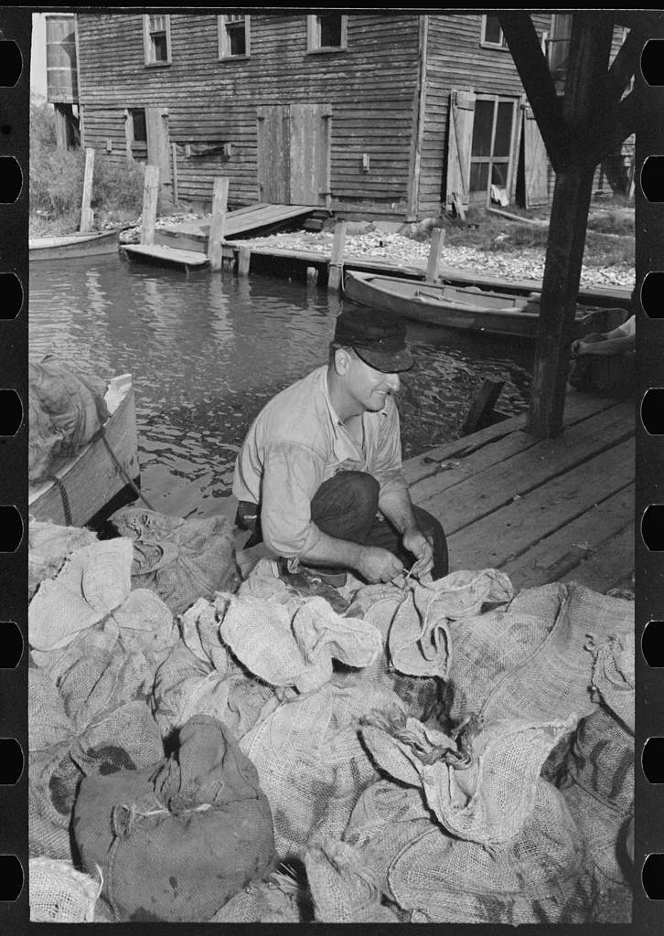 Tying sacks of oysters, Olga, Louisiana, 1938