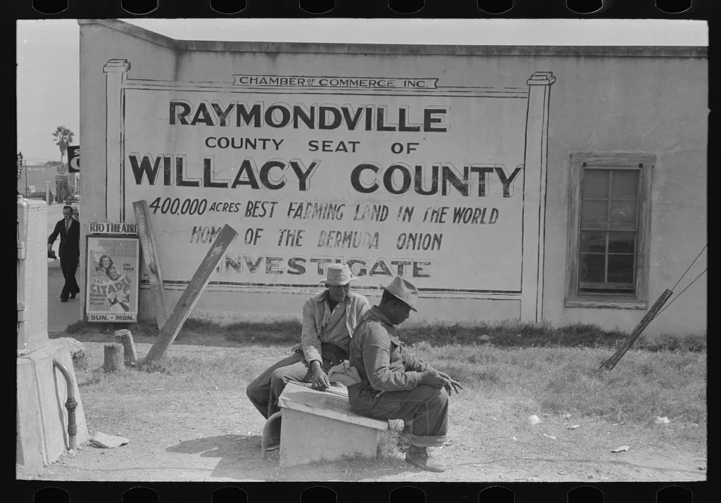 Negroes sitting along railroad tracks, Raymondville, Texas, 1939