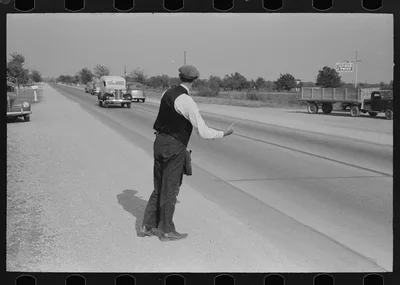 Hitchhiker at city limits of Waco, Texas, 1939