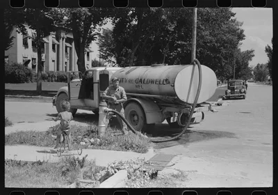 Filling the street-sprinkling wagon. Caldwell, Idaho, 1941