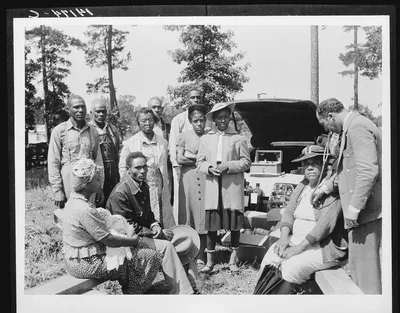 Photograph from 1941: Dr. Lee's traveling clinic serves families at…