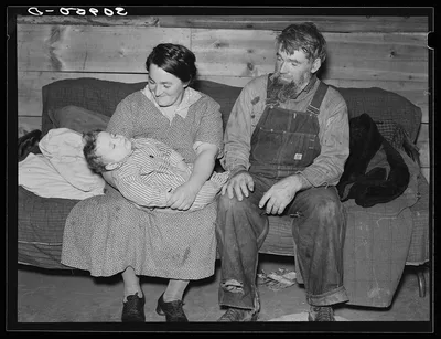 Mr. and Mrs. Harshenberger [i.e. Harshbarger] and baby. Mennonite…, Montana, 1937