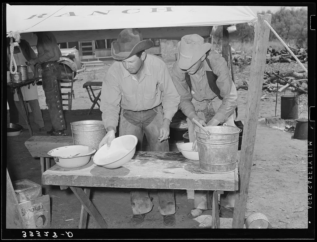 Cowboys of the SMS Ranch washing up for dinner. Ranch near Spur, Texas, 1939