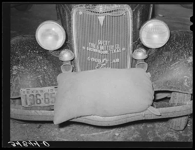 Sack of feed on bumper of automobile. Brownwood, Texas, 1939