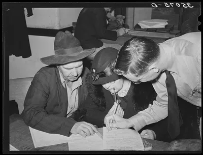 Supervisor helping FSA (Farm Security Administration) clients make…, 1939