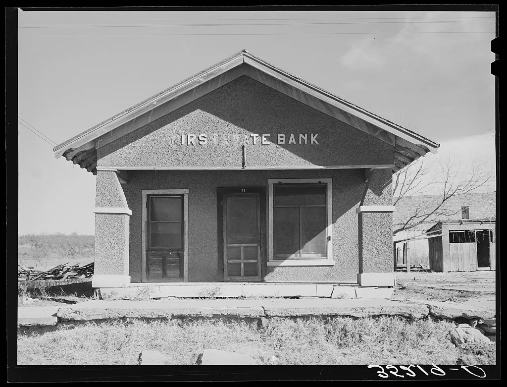 Deserted bank building in the oil ghost town of Slick, Oklahoma, 1940