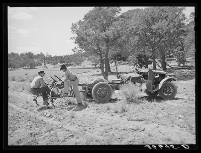 Farmer and his younger brother with tractor which has been adapted…, New Mexico, 1940