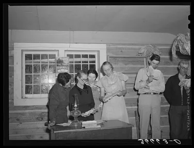 Farmers and wives singing at the literary society. Pie Town, New…, New Mexico, 1940