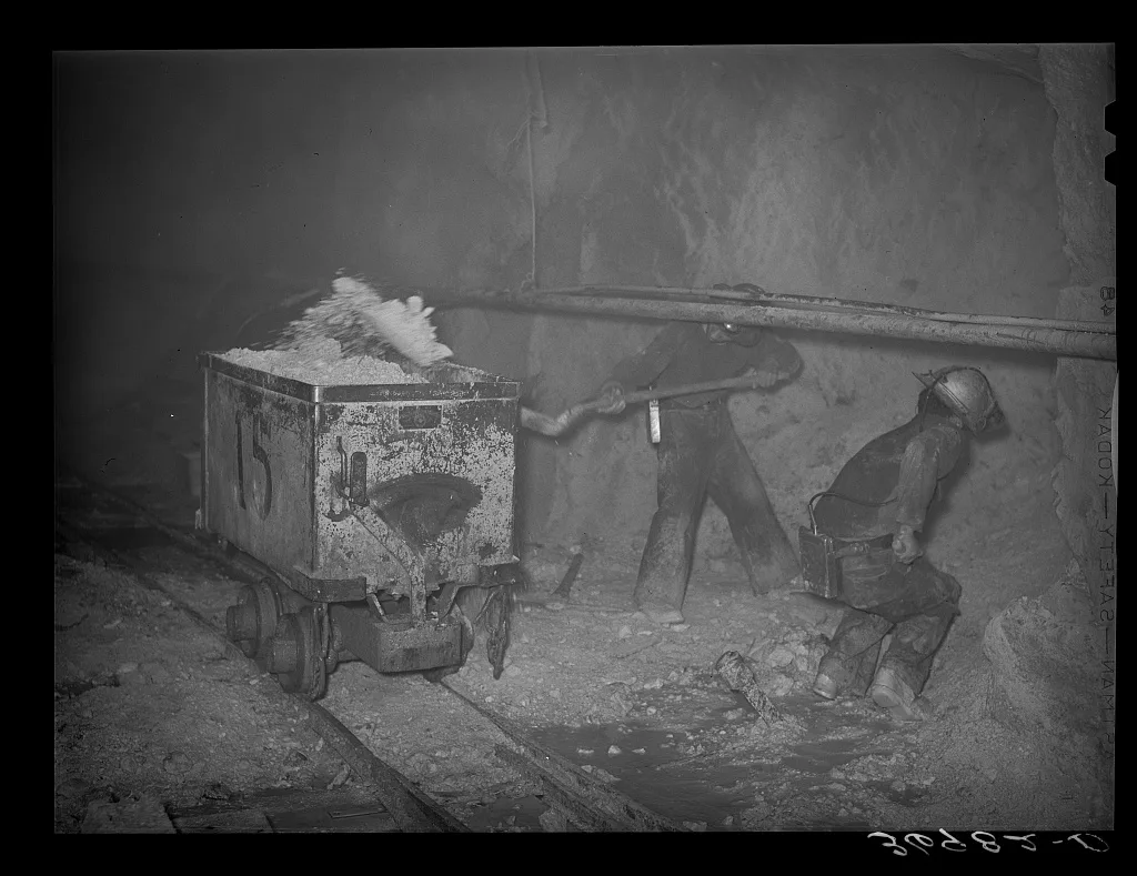 Mucking gold ore at mine. Mogollon, New Mexico, 1940