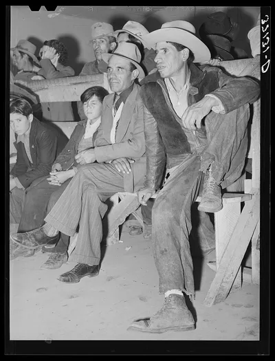 Spanish-American farmers watching show. Penasco, New Mexico, 1940