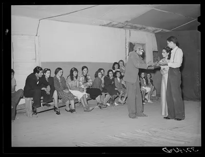 Players and audience at traveling Spanish-American show. Penasco, New…, New Mexico, 1940