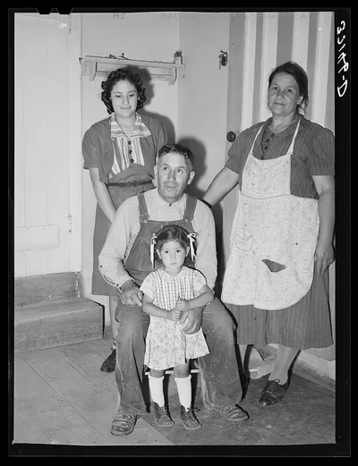 Spanish-American farmer and his family. Chamisal, New Mexico, 1940
