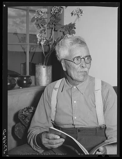 Old Spanish-American man in his home at Chamisal, New Mexico, 1940