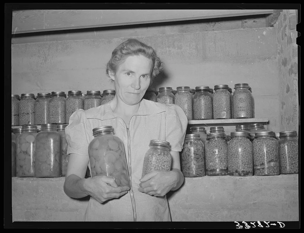 Wife of Mormon farmer with canned goods. Snowville, Utah, 1940