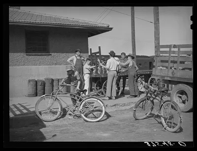 Photograph from Colorado: Distributing newspapers to newsboys at the…