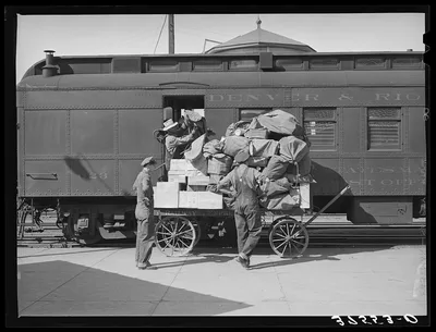 Unloading the mail from the morning train. Montrose, Colorado, 1940