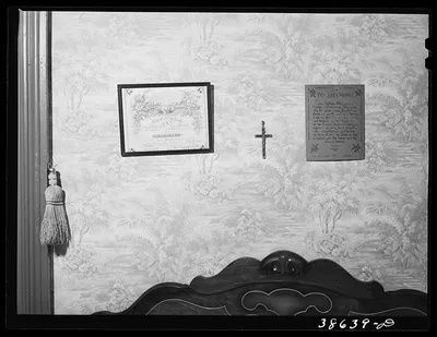 Marriage license and Lord's Prayer above bed in Negro home. Chicago,…, Illinois, 1941