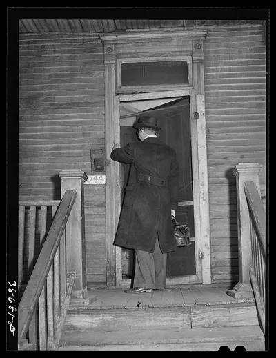 Doctor entering home of relief family. Chicago, Illinois, 1941