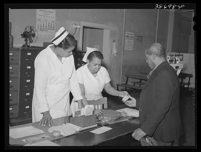 Clinic patient receiving instruction card at municipal tuberculosis…, Illinois, 1941