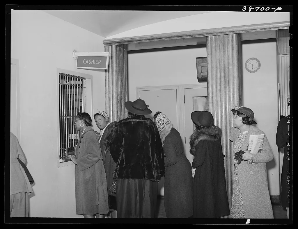 Patients at clinic paying bills. Chicago, Illinois, 1941