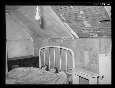 Upstairs bedroom of family on relief. Chicago, Illinois, 1941