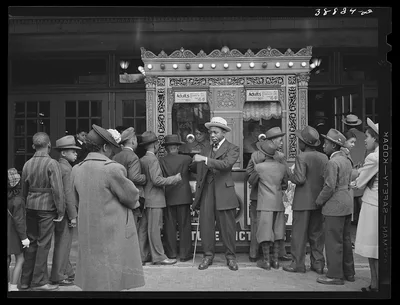 Entrance to movie theater. Southside of Chicago, Illinois, 1941