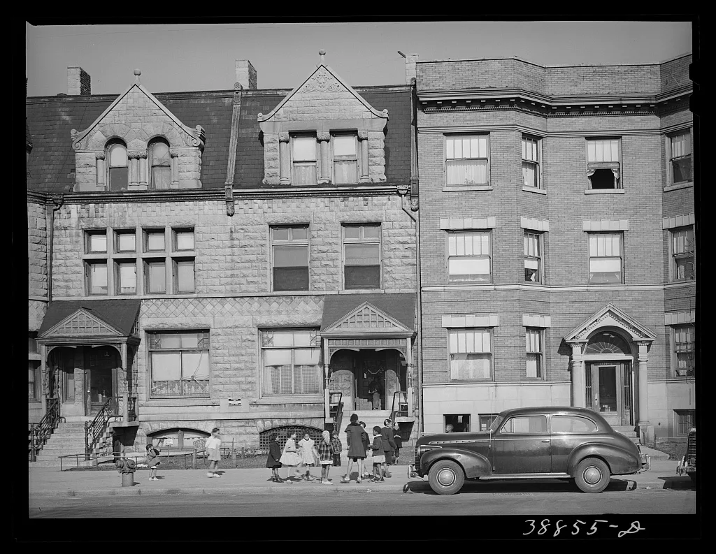 The new and the old in the apartment houses in the Negro section of…, Illinois, 1941