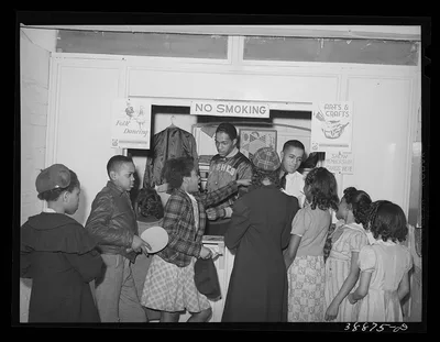 Boys and girls presenting membership cards at recreational booth in…, Illinois, 1941
