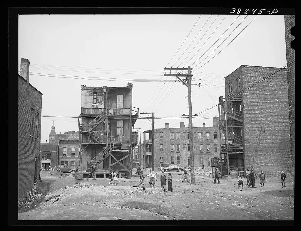 Children playing in vacant lot in Negro section of Chicago, Illinois, 1941