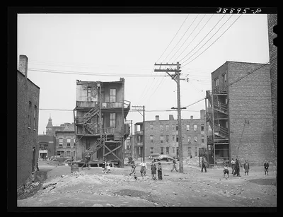 Children playing in vacant lot in Negro section of Chicago, Illinois, 1941