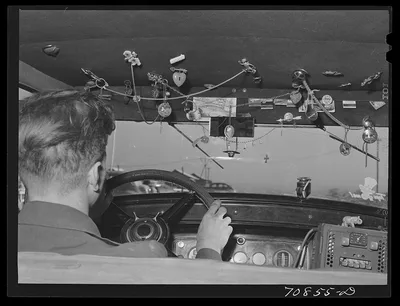Trinkets in agricultural worker's automobile. Wilder, Idaho, 1941