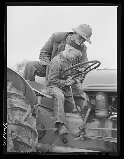 Tulare County, California. Farmer teaching his six-year old son to…, 1942