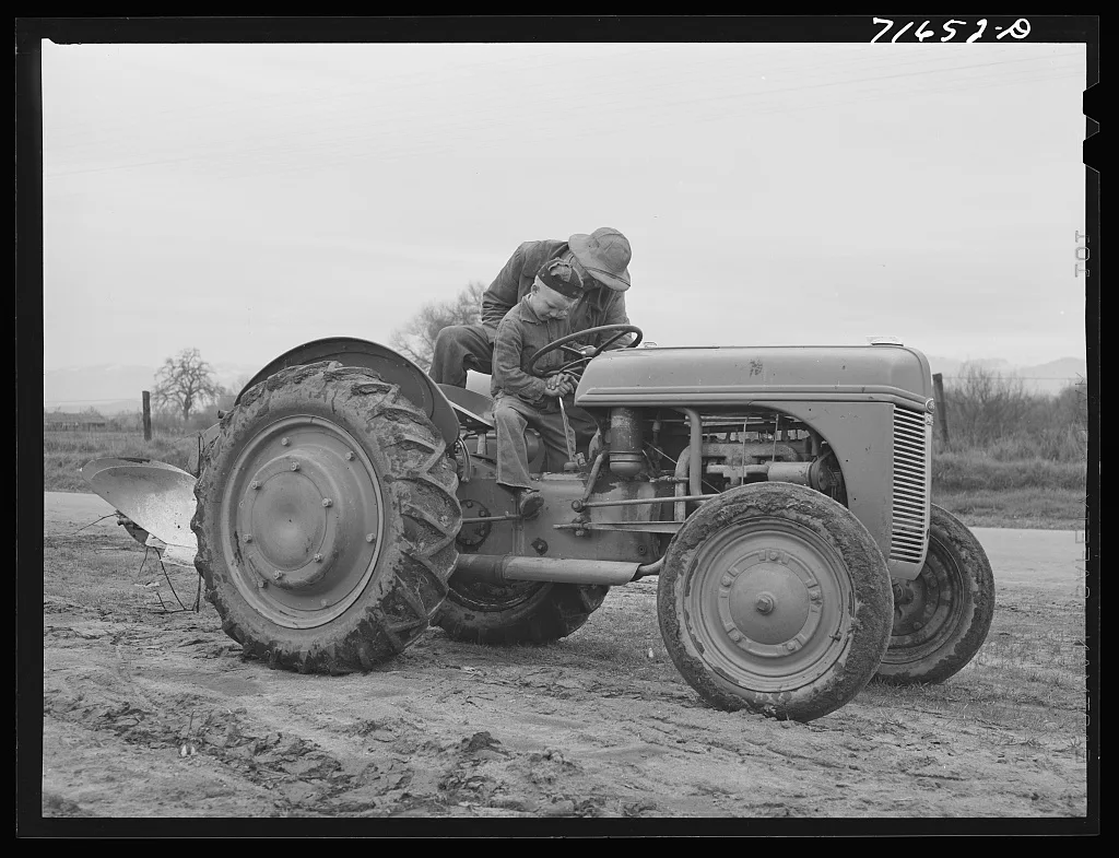 Tulare County, California. Farmer teaching his six-year old son to…, 1942